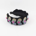 Close-up of colorful rhinestone heart embellishments on a black velvet padded headband - Multi-color Gradient Heart Style (A)