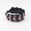 Detailed macro view of pink heart-shaped rhinestones on black velvet padded headband - Pink Purple Heart Style (B)