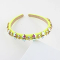 Macro shot of neon yellow headband featuring multi-colored rhinestones on white display - Neon Yellow (G)