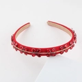 Detail of red crystal baroque headband featuring sparkling rhinestones and satin lining - Red (G)