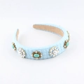 Detail of light blue faux leather headband with pearl starburst and blue stone accents - Light Blue(C)