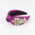 Detailed view of purple satin headband with hand-sewn pearls and rhinestone flowers - Purple