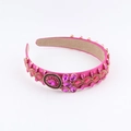 Detailed macro view of magenta satin headband with hand-set pink rhinestones and gems - Rose Red