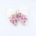 Close-up of elegant black bow hair claw clip with pink crystals and pearls detail - Sweet Pink Orange Rhinestone White Velvet Style (H)