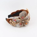 Detailed macro view of woven brown velvet headband with sparkling rhinestone flower motifs - Coffee Style (C)