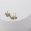 Detailed close-up of 14K gold-plated heart earrings with blue micro-bead inlay details - Turquoise (ES0220)