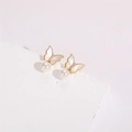 Close-up of golden butterfly earrings with shell wings, zircons, and round pearls - Shell Pearl Butterfly