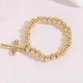 Detail shot of a 14K gold-plated beaded ring with a polished cross pendant accessory - One Size / Smooth Cross