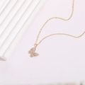 Elegant gold butterfly pendant necklace with sparkling zircons and pink marquise stone - Butterfly Zircon Style