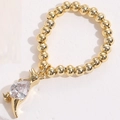 Macro detail of elastic beaded ring with golden cat charm and teardrop zircon stone - Cat Waterdrop Zirconia Style (JZ0090)