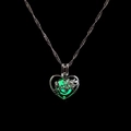 Detailed view of luminous hollow heart necklace with Mother engraving in glowing green - Green