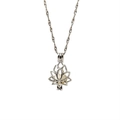 Detailed view of silver hollow lotus cage pendant necklace with a white round pearl center - Lotus Style