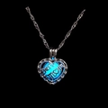 Detailed close-up of heart-shaped luminous Best Mom necklace glowing in dark blue - Blue