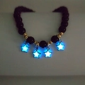 Luminous star pendant beaded bracelet with dark brown beads and golden accents - Star Blue Glow