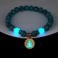 Luminous turquoise yoga bracelet featuring glowing Buddha charm and blue fluorescent beads - Blue Turquoise Gold Finish Blue Glow