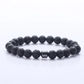 Detail of 8mm black lava stone beads with a smooth hematite cylinder on a men's bracelet - Lava Stone