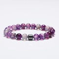Detail of 8mm purple fluorite beaded bracelet with a grey metal spacer bead - Striped Purple Agate