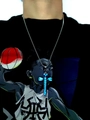 Close-up of a dragonfly cross pendant glowing bright blue on a silver metal chain - Stainless Steel Ball Chain / Blue