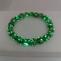 Detail view of healing luminous green glass beads bracelet with sparkling gold sand effect - Large / Green