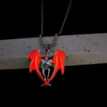 Gothic skull necklace with vibrant orange bat wings and silver metal chain pendant - Orange Light