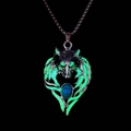Detail of glow in the dark wolf head pendant with green luminous eyes and turquoise stone - Green