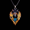Close-up of wolf head pendant with orange flame patterns and turquoise stone detail - Orange Light