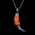 Close-up of wolf tooth necklace with orange flame pattern and silver bead chain - Orange Light
