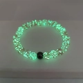 Luminous beaded bracelet with glowing green glass beads and a single black bead accent - Small / Pink