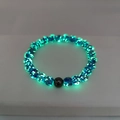 Luminous blue crystal beads bracelet with dark green glow and black center bead - Small / Lake Blue