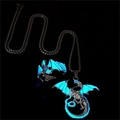 Luminous dragon pendant and ring set with blue glow in the dark wings on black background - Blue