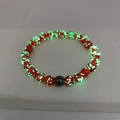 Luminous red beaded bracelet with glowing green spots and black accent bead - Small / Red