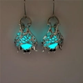 Detailed view of luminous bat earrings with silver filigree and cyan glow in the dark - Silver Teal Glow