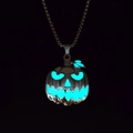 Glow in the dark Halloween pumpkin pendant necklace showing bright blue luminous effect - Cyan Glow