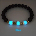 Glow-in-the-dark blue beads and black lava stone details on a lotus bracelet - Blue