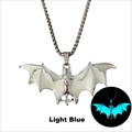 Detail of silver bat necklace with light blue glowing effect in dark environment - Silver Teal Glow