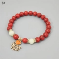 Detailed close-up of Super Mom heart charm and red turquoise beads on luminous bracelet - Red Turquoise KC Gold Green Glow