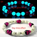 Luminous skull beaded bracelet showing blue night glow and daytime appearance - Rose Red Skull Blue-Green Glow