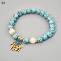 Detailed view of Super Mom heart pendant and turquoise beaded bracelet with crystals - Blue Turquoise KC Gold Blue Glow