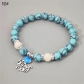Detail of beaded Super Mom bracelet with turquoise texture beads and blue heart charm - Blue Turquoise Silver Blue Glow