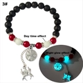 Detail of glow in the dark beads and spider web pendant on volcanic stone bracelet - Cyan Glow (3#)