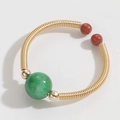 Adjustable gold copper wire ring with green gemstone bead and red accents - Jadeite Style