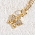 Golden star pendant necklace with sparkling zircon butterfly detail and delicate chain - Star 14K Gold