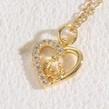 Golden heart necklace featuring a family silhouette and sparkling zircon stones - Heart 14K Gold Plated