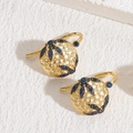 Vintage golden hammered ball earrings with dark blue and clear zircon stone accents - Sapphire Blue
