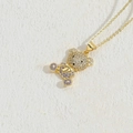 Golden bear pendant necklace with white and purple zircon crystals in a minimalist setting - Purple Zirconia Bear Necklace MA1-7