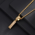 Detailed macro view of the iced-out baguette cut zircon pendant on a gold twisted rope chain - Letter I / Rope Chain Necklace / Gold