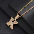 Detailed close-up of golden letter K pendant with micro-pave zircons and twist rope chain - Letter K / Rope Chain Necklace / Gold