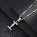 Macro shot of a silver hip-hop letter I pendant with white zircon on a rope chain - Letter I