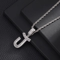 Detail of silver J letter pendant with baguete zircons on a twisted rope chain - Letter J