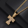 Macro detail of gold-plated letter T pendant with cubic zirconia stones on rope chain - Letter T / Rope Chain Necklace / Gold